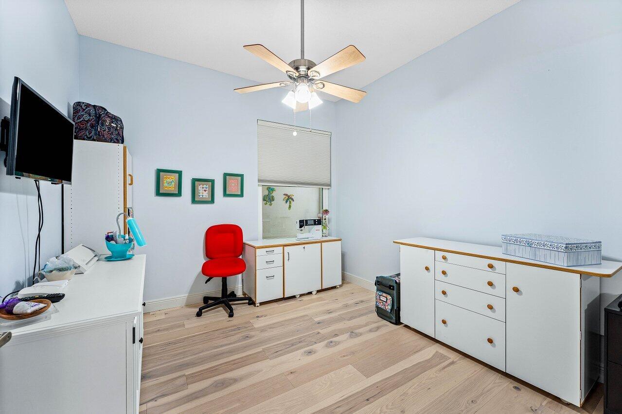 198 Hampton Circle Jupiter, FL 33458 - Photo 19 of 32 a living room with furniture and a flat screen tv
