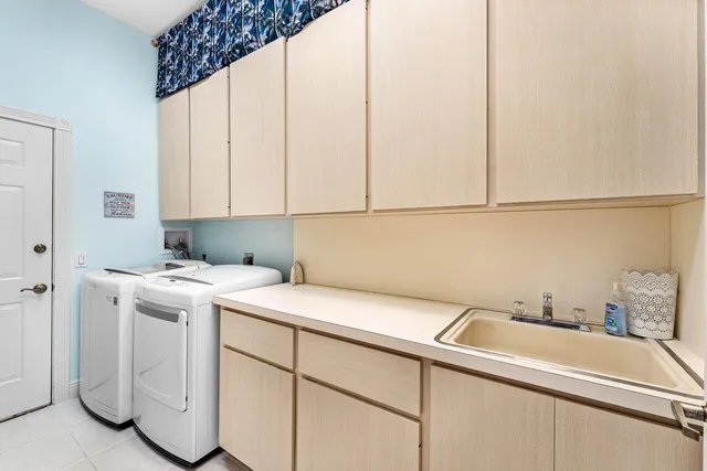 a view of a chair and tables in the patio