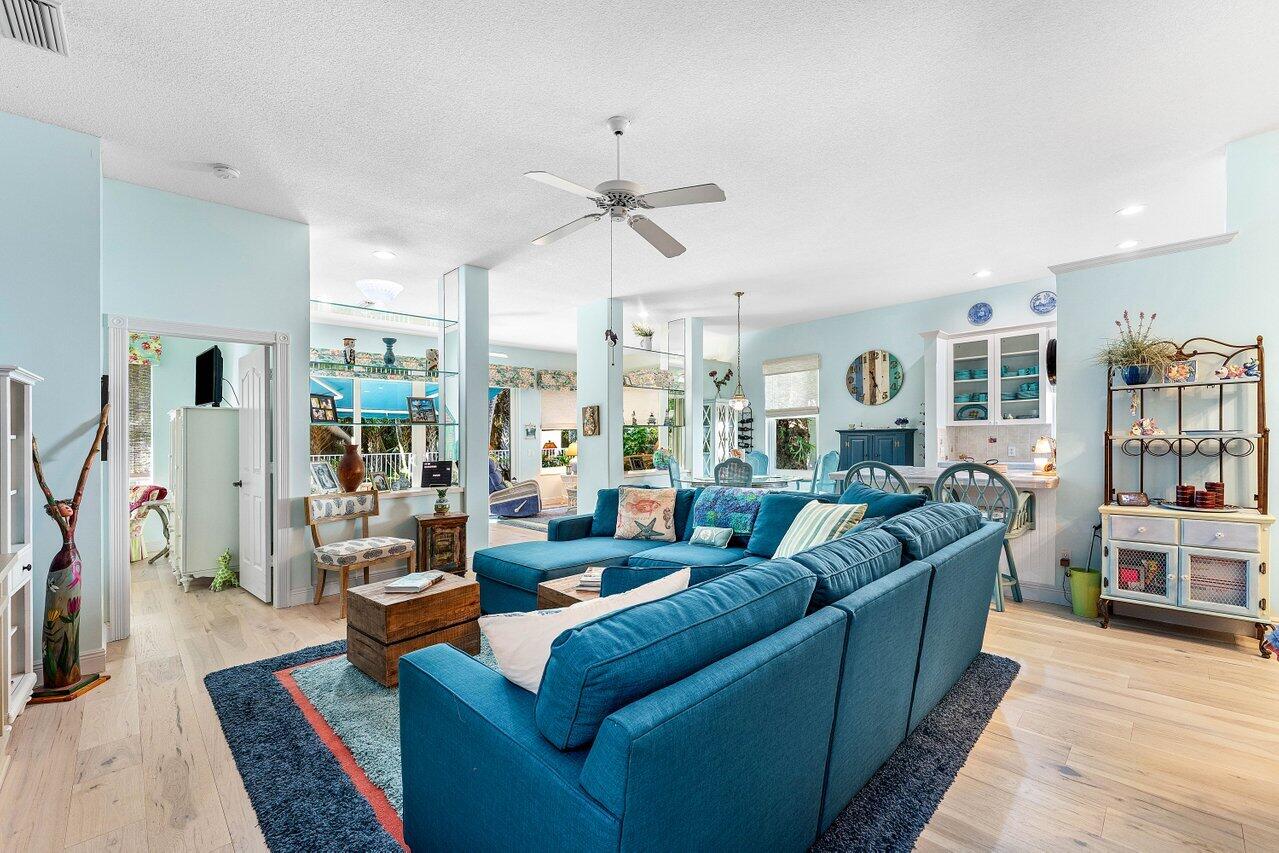 198 Hampton Circle Jupiter, FL 33458 - Photo 8 of 32 a living room with furniture or couch and a bookshelf