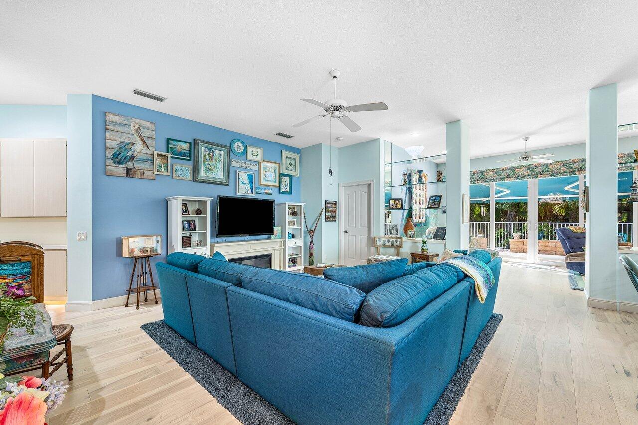 198 Hampton Circle Jupiter, FL 33458 - Photo 10 of 32 a living room with furniture and a flat screen tv