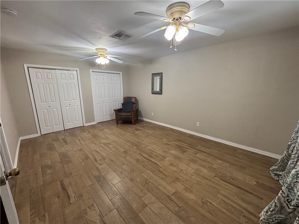 4957 Shadowbend Drive Corpus Christi, TX 78413 - Photo 32 of 35 a view of empty room with wooden floor