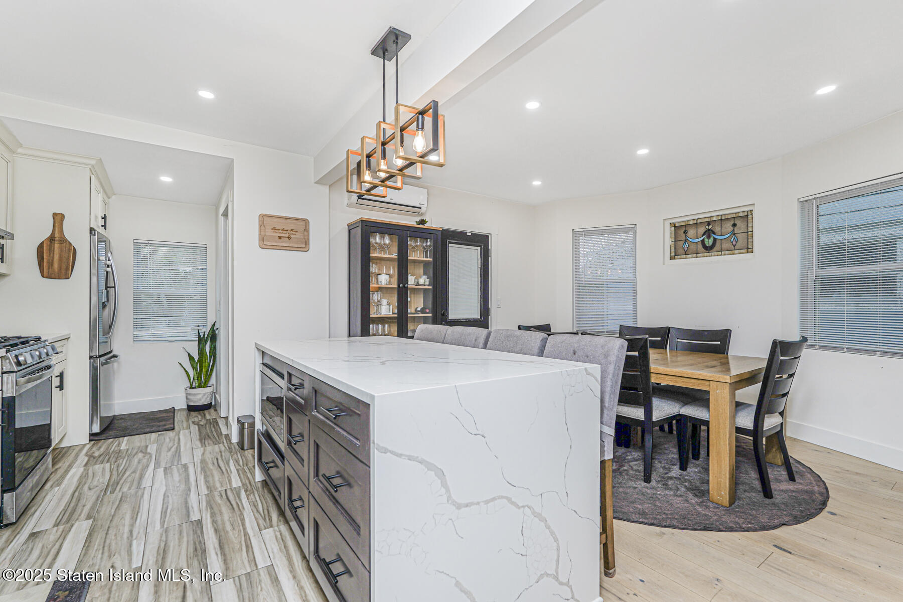 145 Clinton Place Staten Island, NY 10302 - Photo 12 of 41 a view of a dining room with furniture window and wooden floor