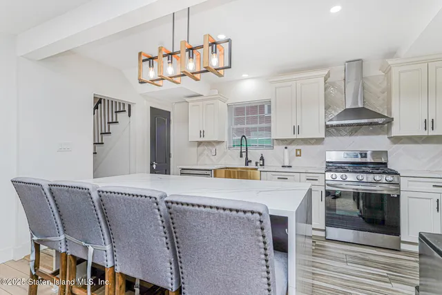 a kitchen with a table and chairs in it