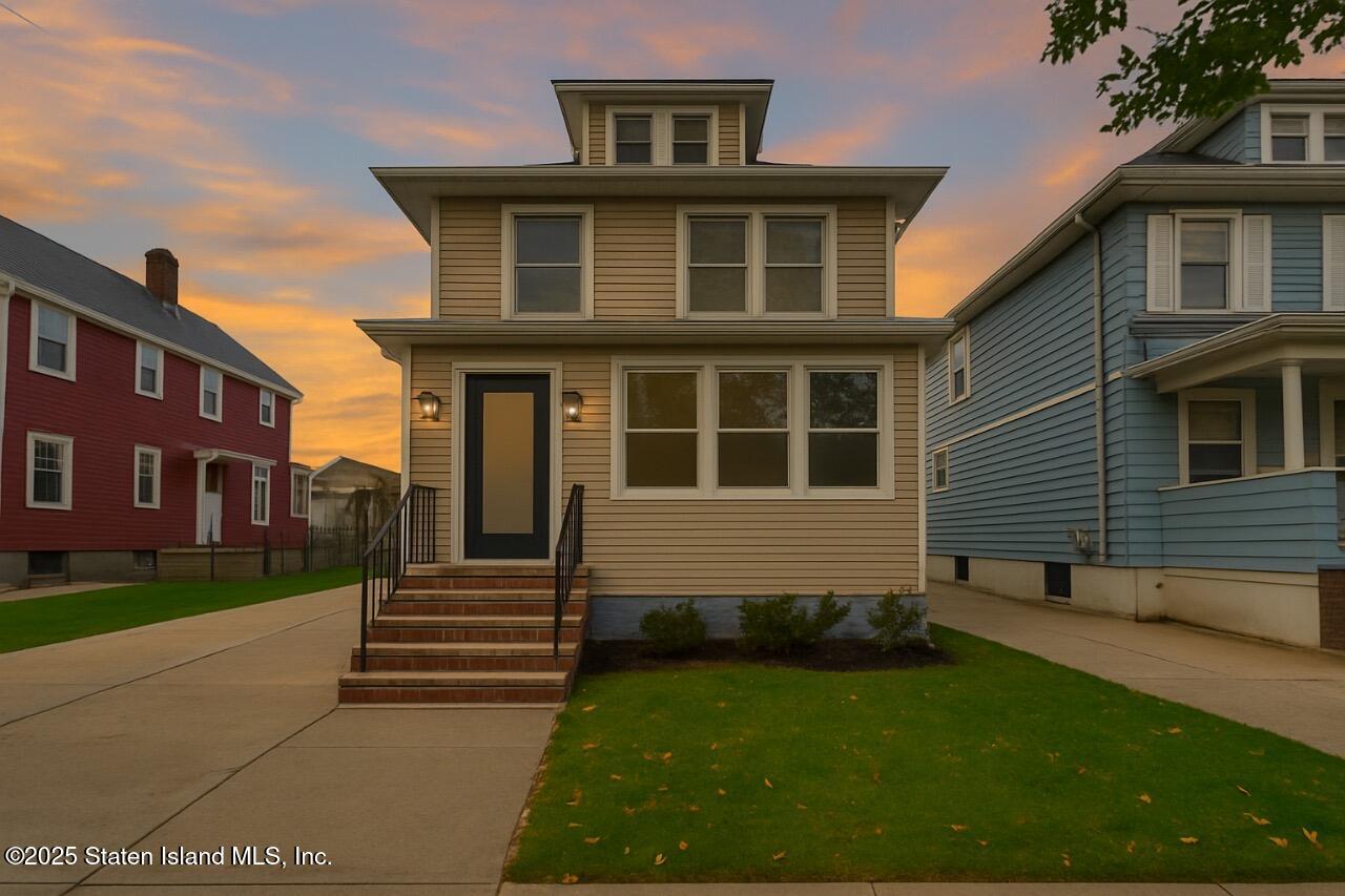 145 Clinton Place Staten Island, NY 10302 - Photo 2 of 41 a front view of a house with garden