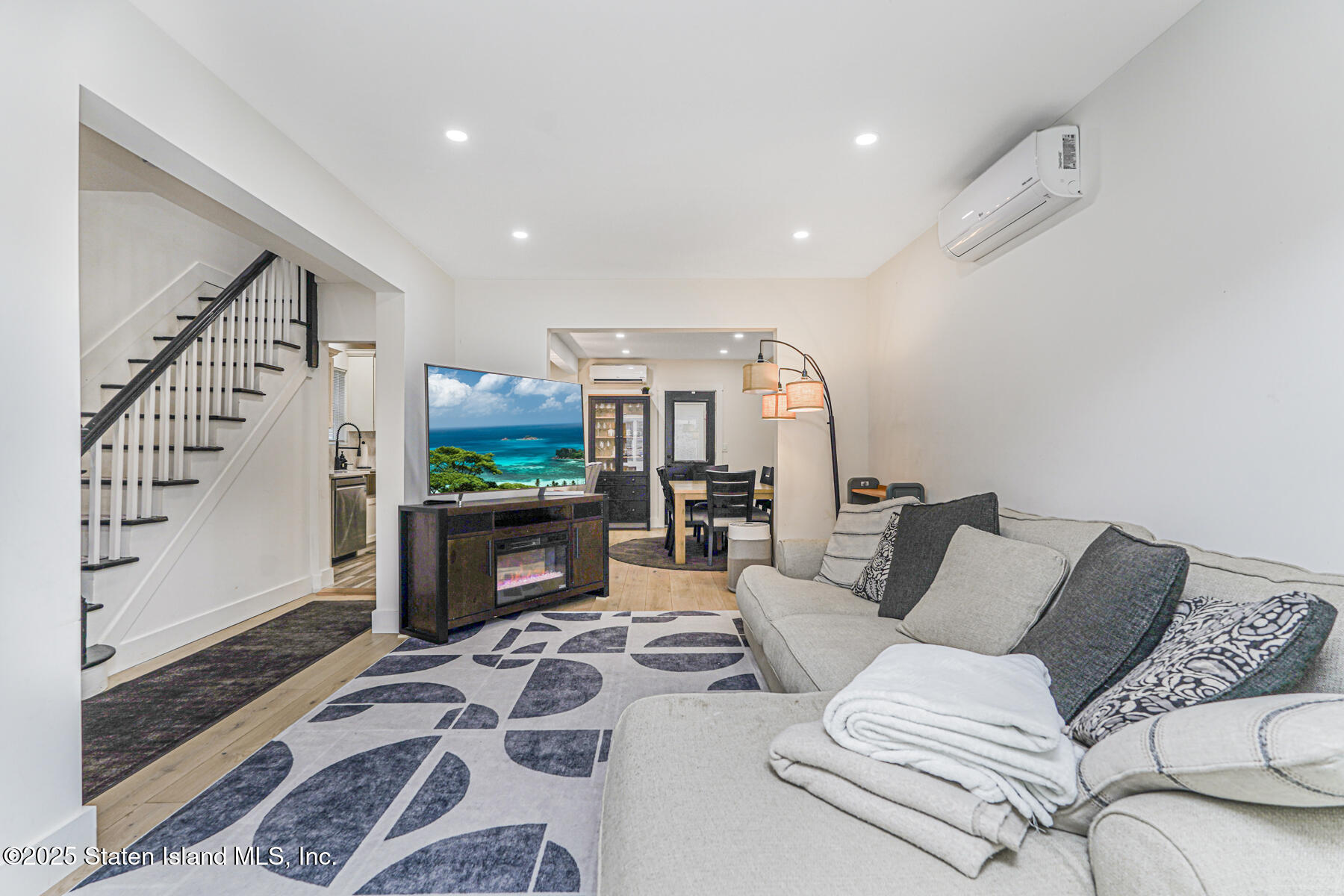 145 Clinton Place Staten Island, NY 10302 - Photo 21 of 41 a living room with furniture and a wooden floor