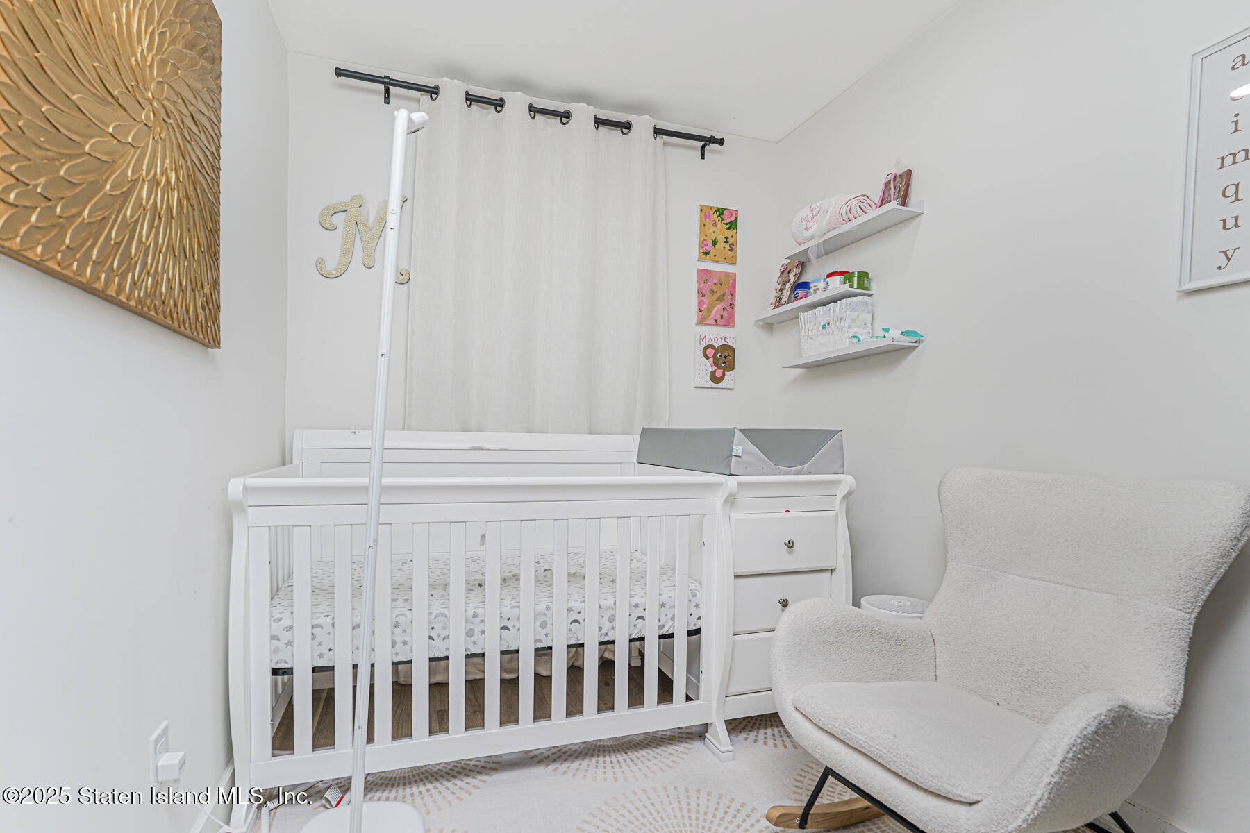 145 Clinton Place Staten Island, NY 10302 - Photo 25 of 41 a bathroom with a sink and a window
