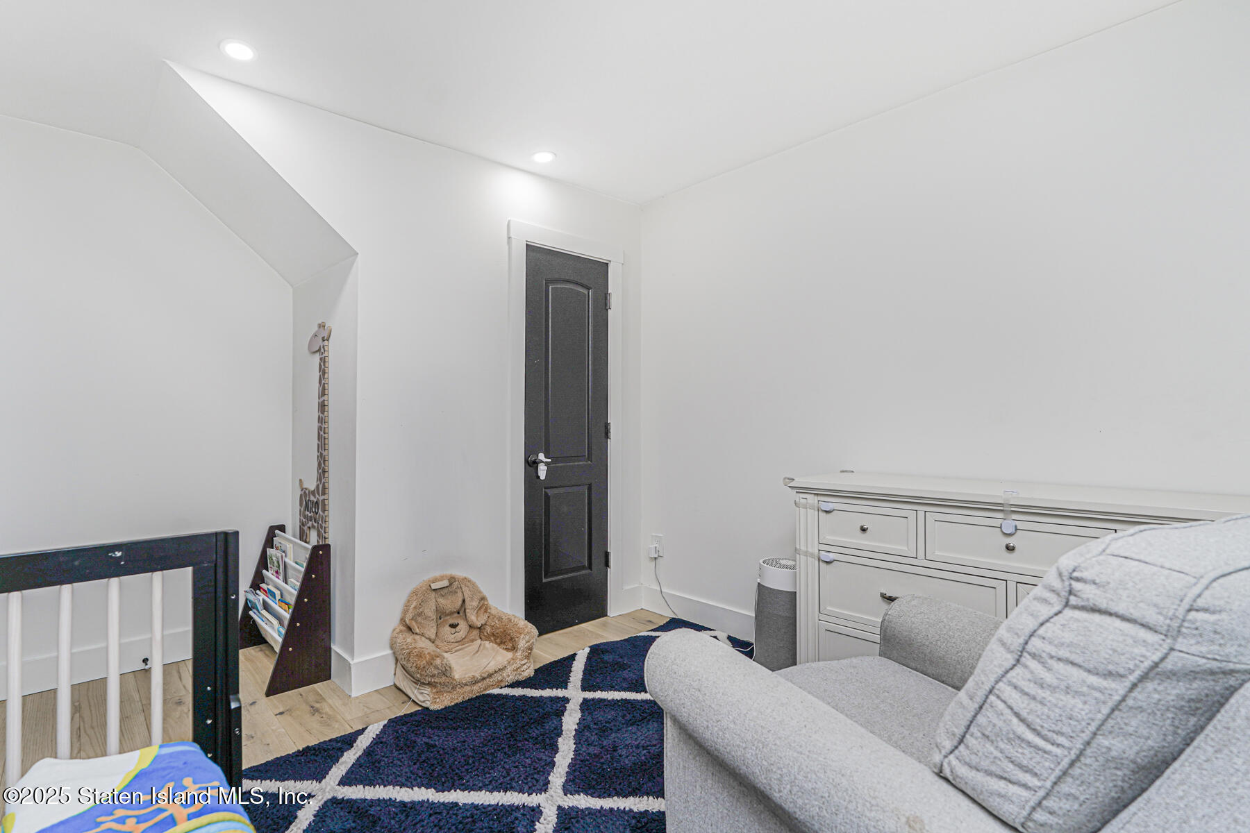145 Clinton Place Staten Island, NY 10302 - Photo 26 of 41 a living room with furniture and a rug