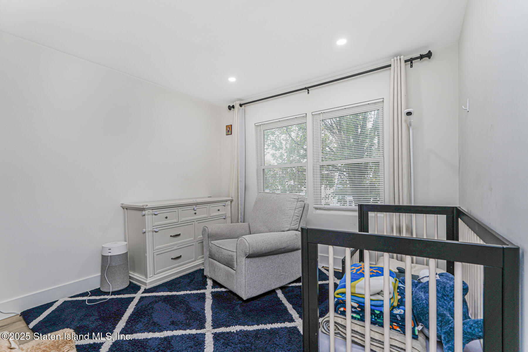 145 Clinton Place Staten Island, NY 10302 - Photo 27 of 41 a bedroom with furniture and a window