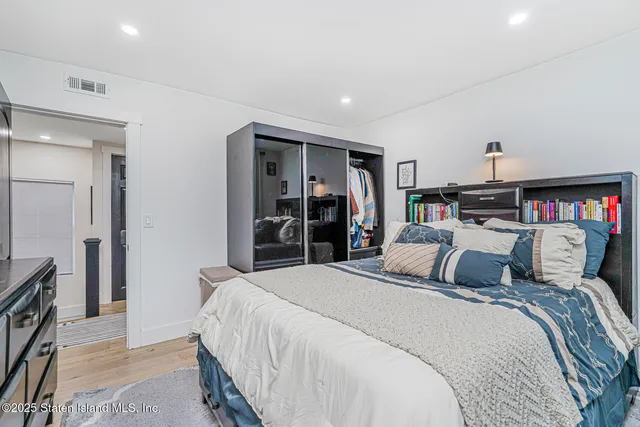 a bedroom with a bed and a closet