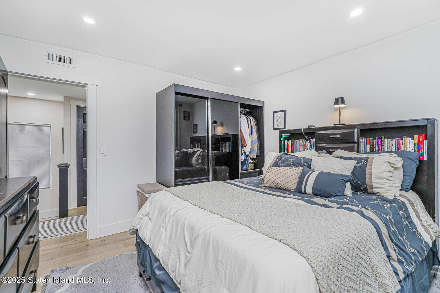 145 Clinton Place Staten Island, NY 10302 - Photo 29 of 41 a bedroom with a bed and a closet