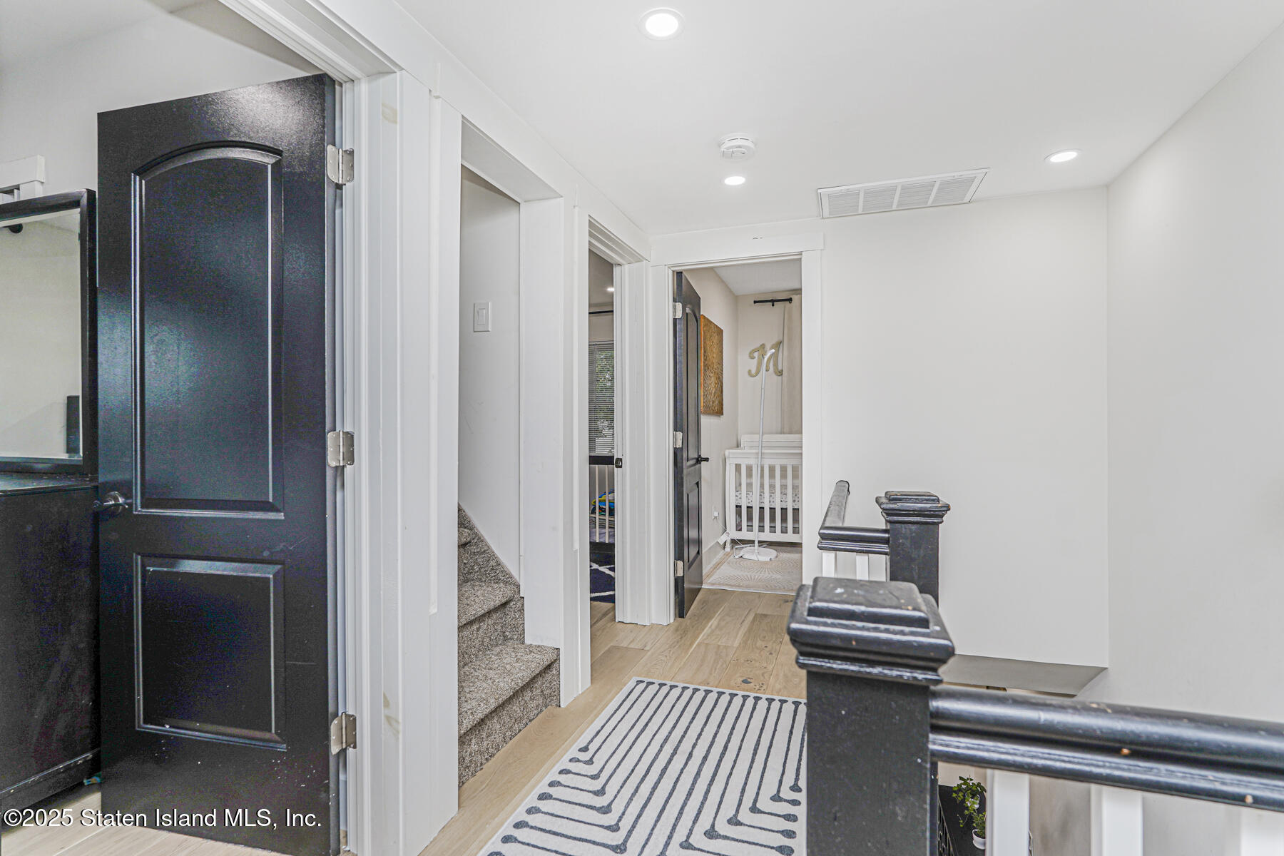 145 Clinton Place Staten Island, NY 10302 - Photo 31 of 41 a bathroom with a sink and a mirror