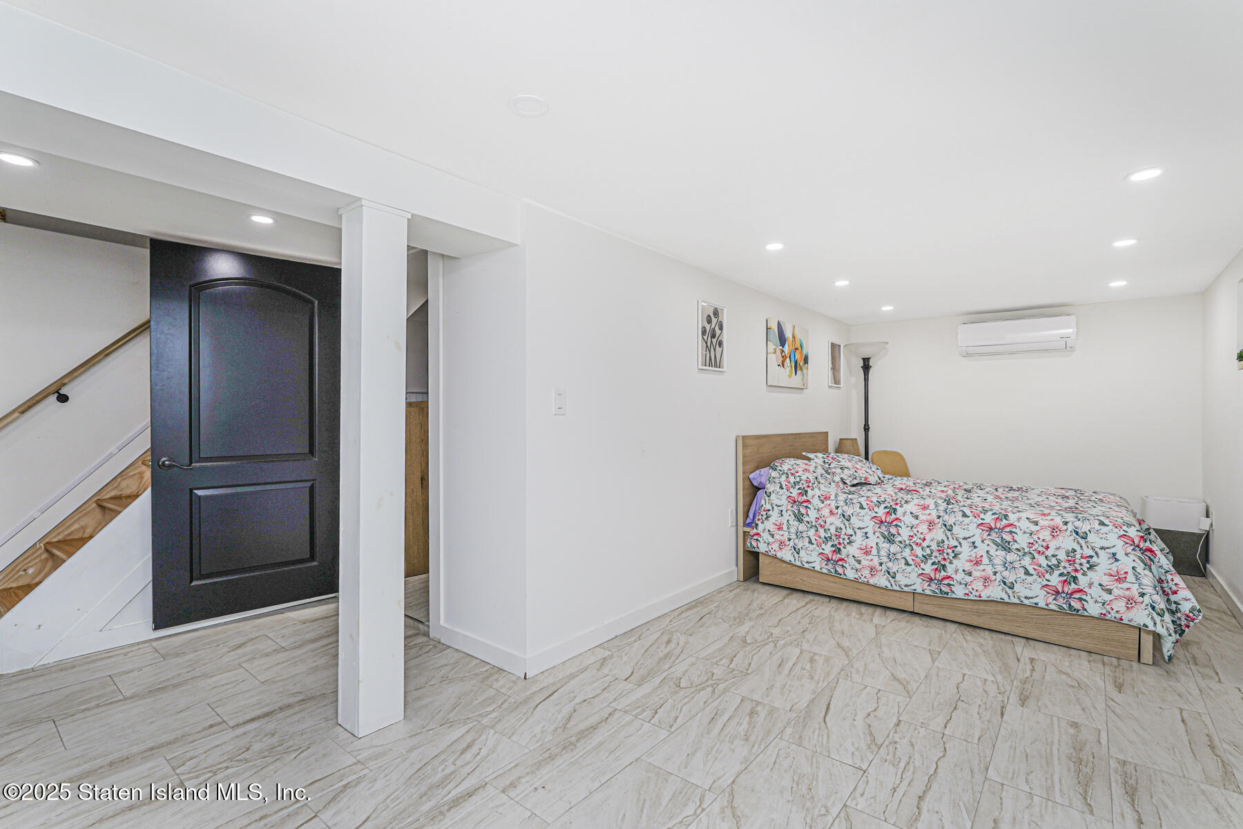 145 Clinton Place Staten Island, NY 10302 - Photo 35 of 41 a very nice looking bedroom with a bed and a dresser