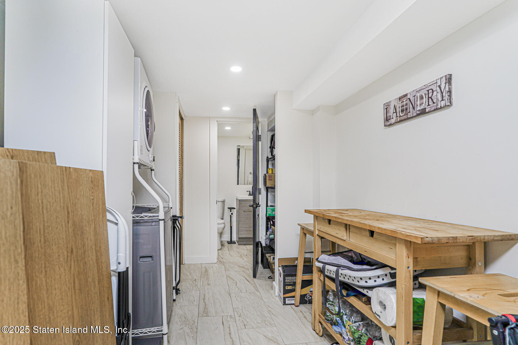 145 Clinton Place Staten Island, NY 10302 - Photo 37 of 41 a view of hallway with wooden floor and stairs