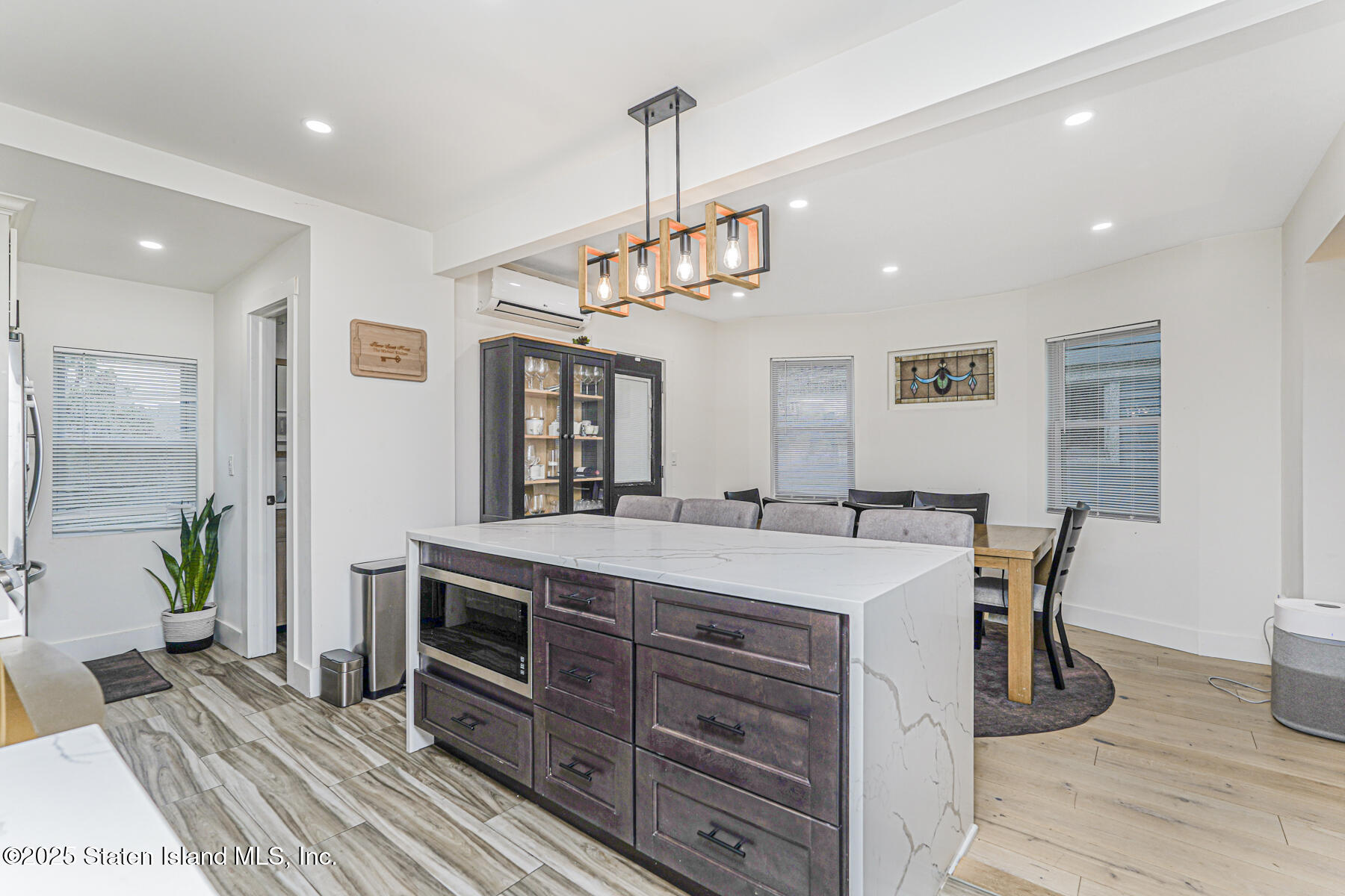 145 Clinton Place Staten Island, NY 10302 - Photo 9 of 41 a view of a dining room with furniture window and wooden floor