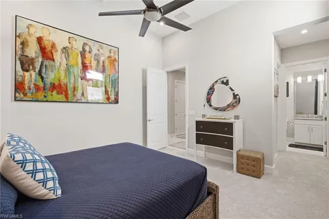 a bedroom with furniture and a fireplace