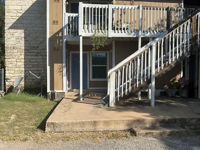 a view of a building with a porch