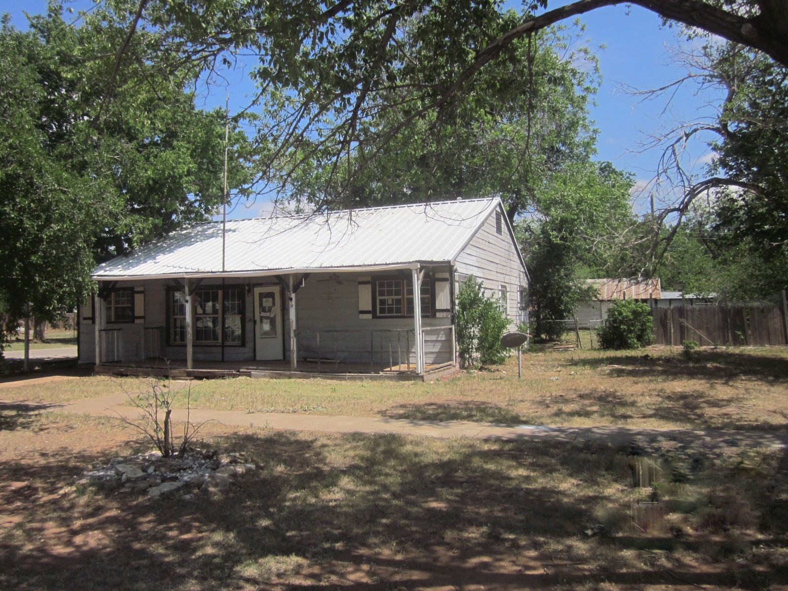 401 Ave F Southeast Childress, TX 79201 - Photo 4 of 10 a front view of a house with a yard
