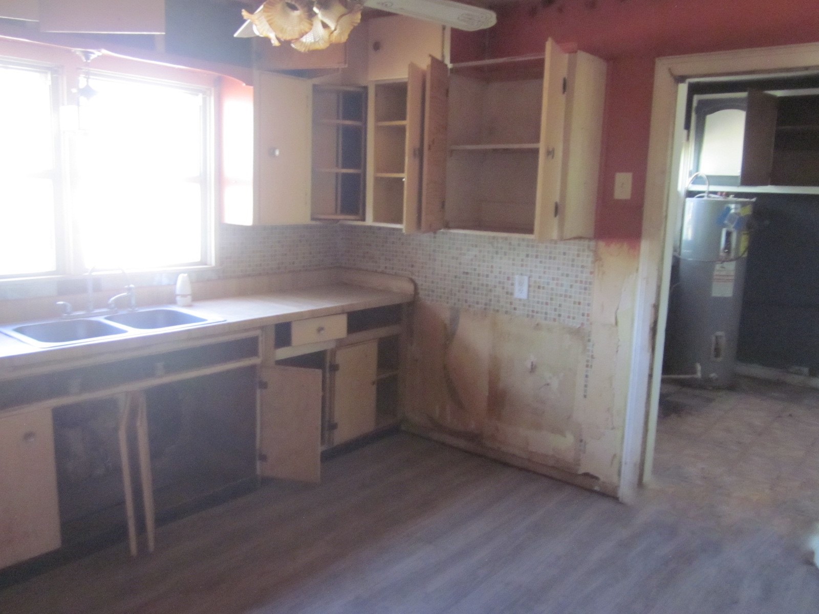 401 Ave F Southeast Childress, TX 79201 - Photo 9 of 10 a kitchen with a sink and refrigerator