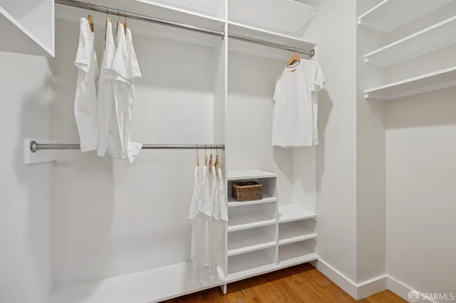 a living room with furniture and a book shelf