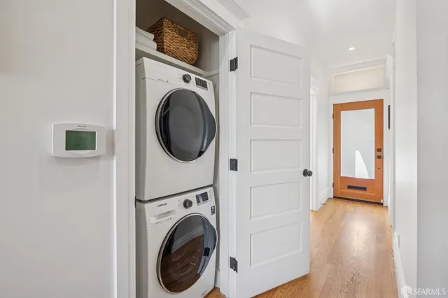 a view of a patio with couches table and chairs and potted plants
