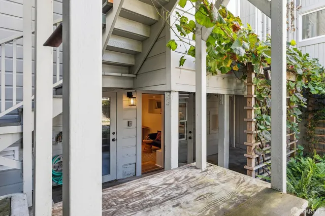 an aerial view of residential houses with outdoor space