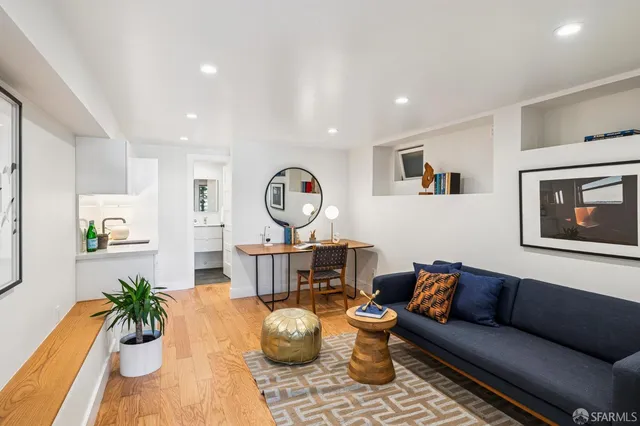 an aerial view of multiple houses with yard