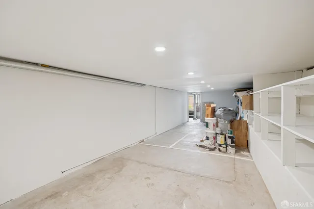 a view of a brick wall with an outdoor space