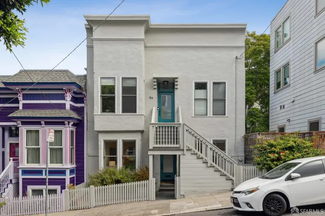 a view of street with parked cars