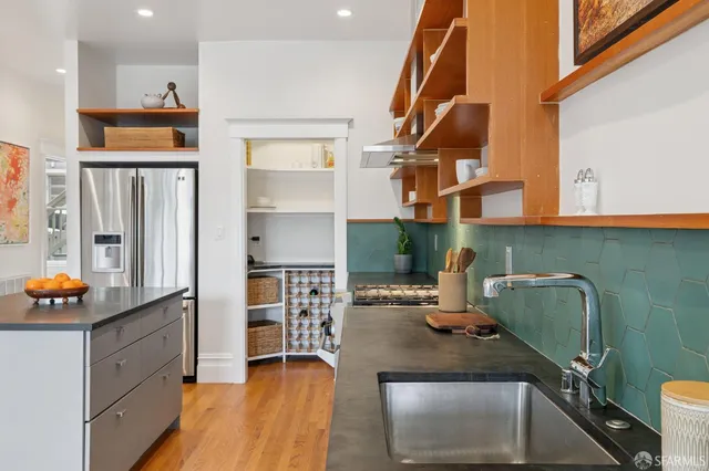 a bedroom with bed and wooden floor