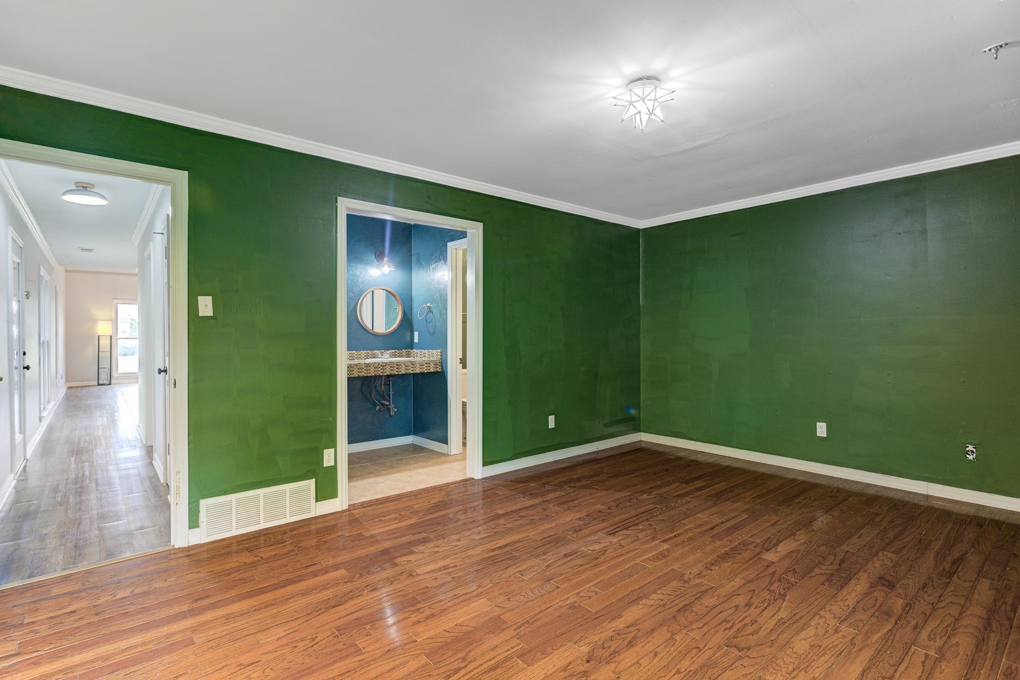 218 South Walnut Bend Road Memphis, TN 38018 - Photo 11 of 25 Unfurnished room with ornamental molding and wood finished floors
