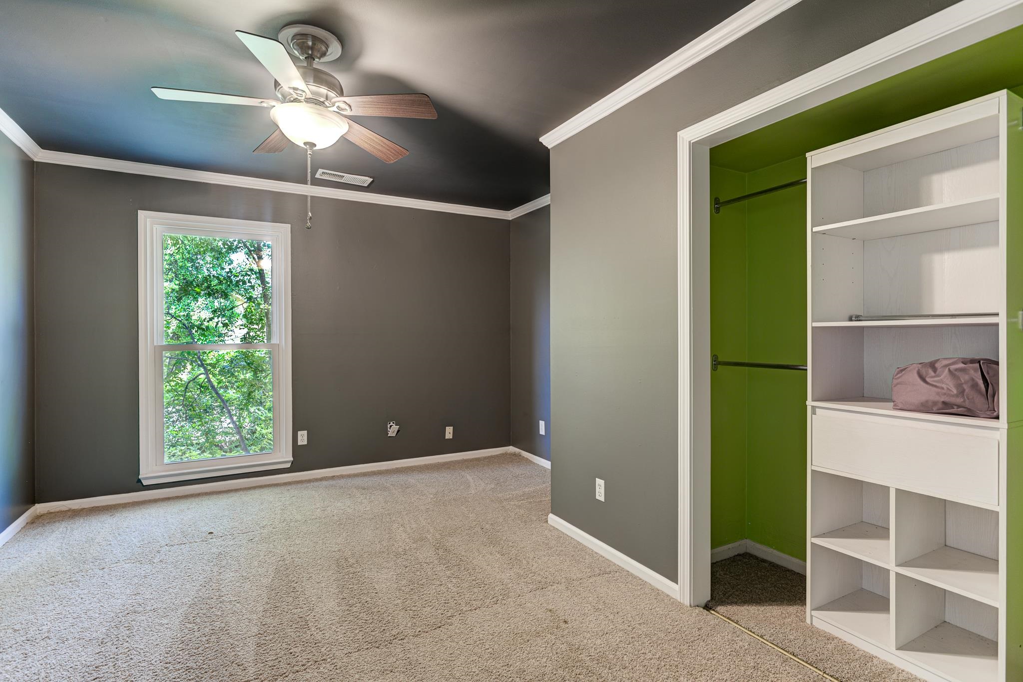 218 South Walnut Bend Road Memphis, TN 38018 - Photo 15 of 25 Unfurnished bedroom featuring ornamental molding, light carpet, and a ceiling fan