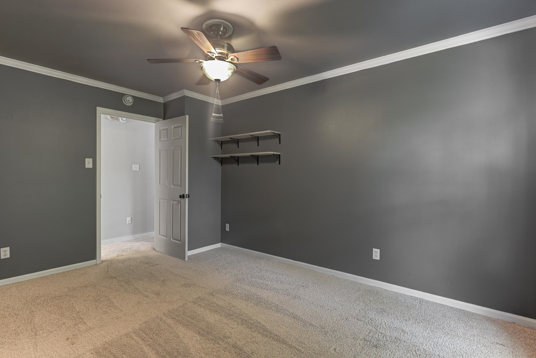 218 South Walnut Bend Road Memphis, TN 38018 - Photo 16 of 25 Unfurnished room featuring crown molding, light colored carpet, and ceiling fan