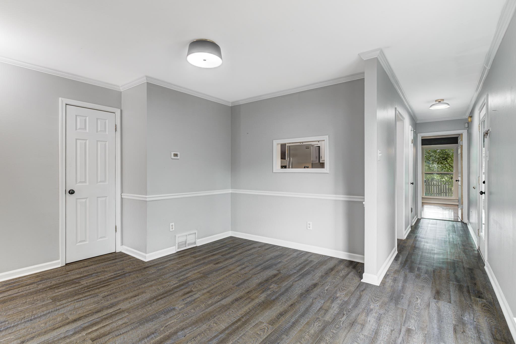 218 South Walnut Bend Road Memphis, TN 38018 - Photo 19 of 25 Spare room with crown molding and dark wood finished floors