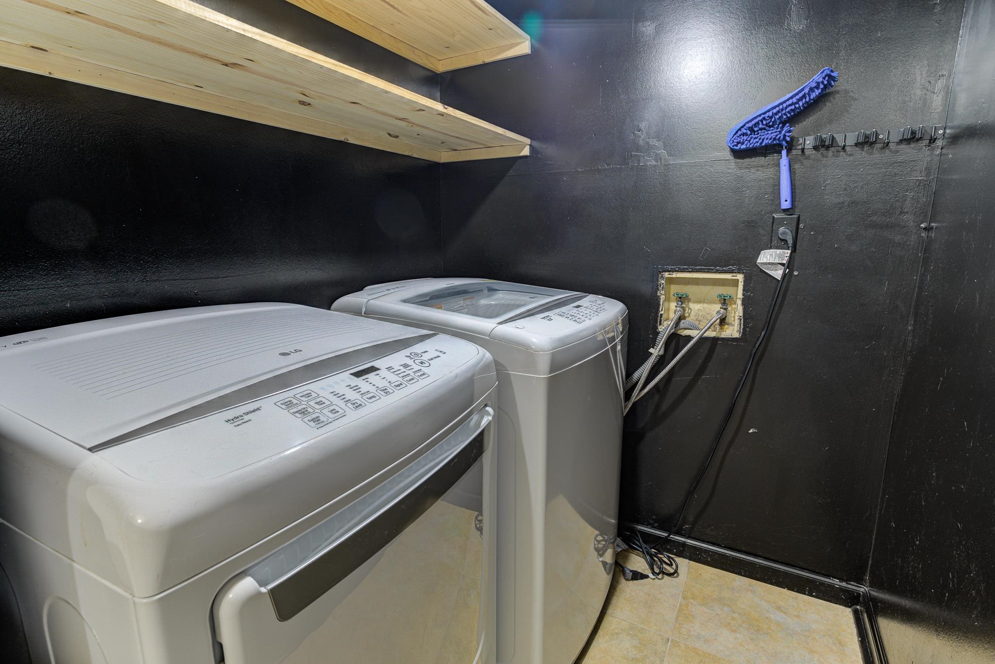 218 South Walnut Bend Road Memphis, TN 38018 - Photo 21 of 25 Laundry room featuring washing machine and dryer and light tile patterned floors