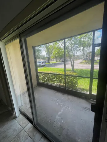 an empty room with a empty space and windows