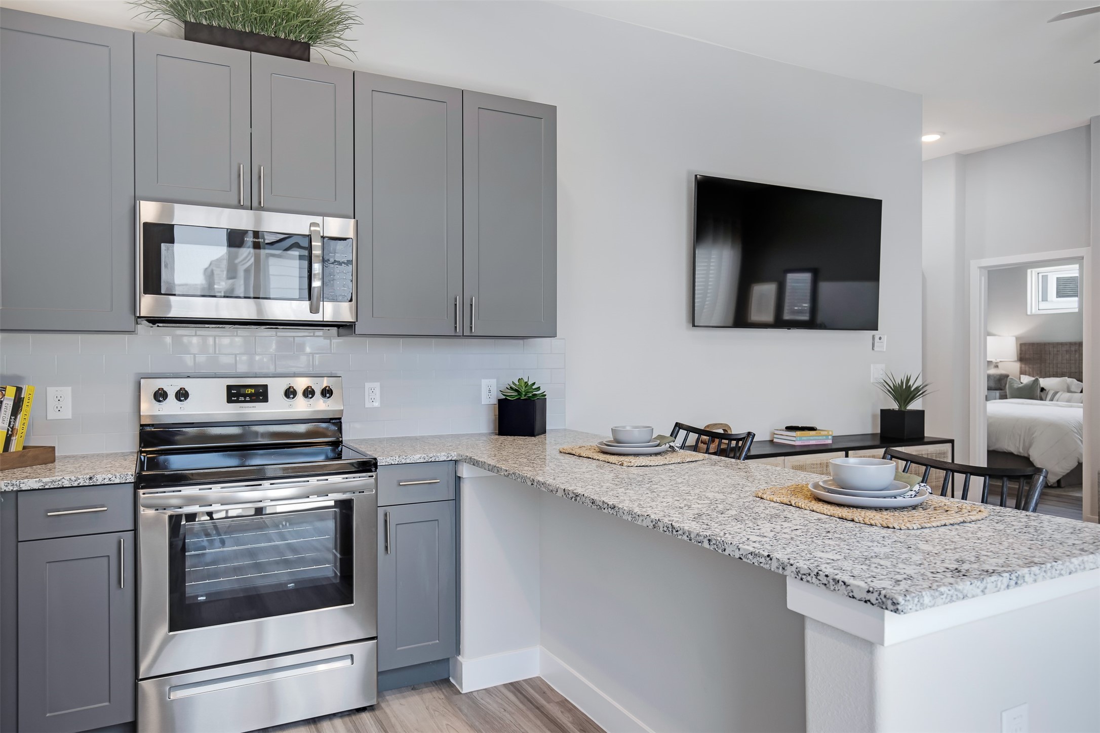 7225 Rustle Road Fort Worth, TX 76123 - Photo 12 of 38 a kitchen with granite countertop a sink cabinets and stainless steel appliances