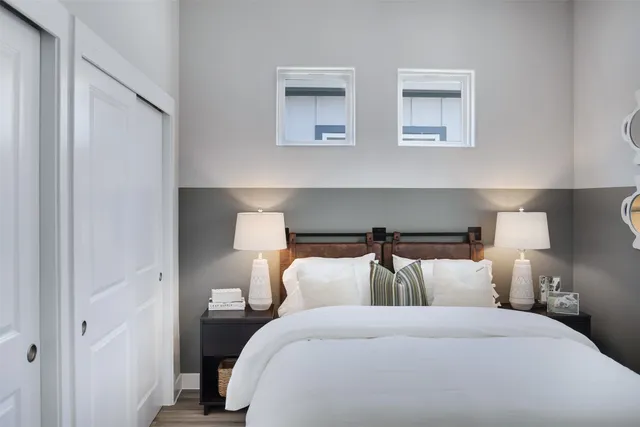 a bed room with double bed and a night stand