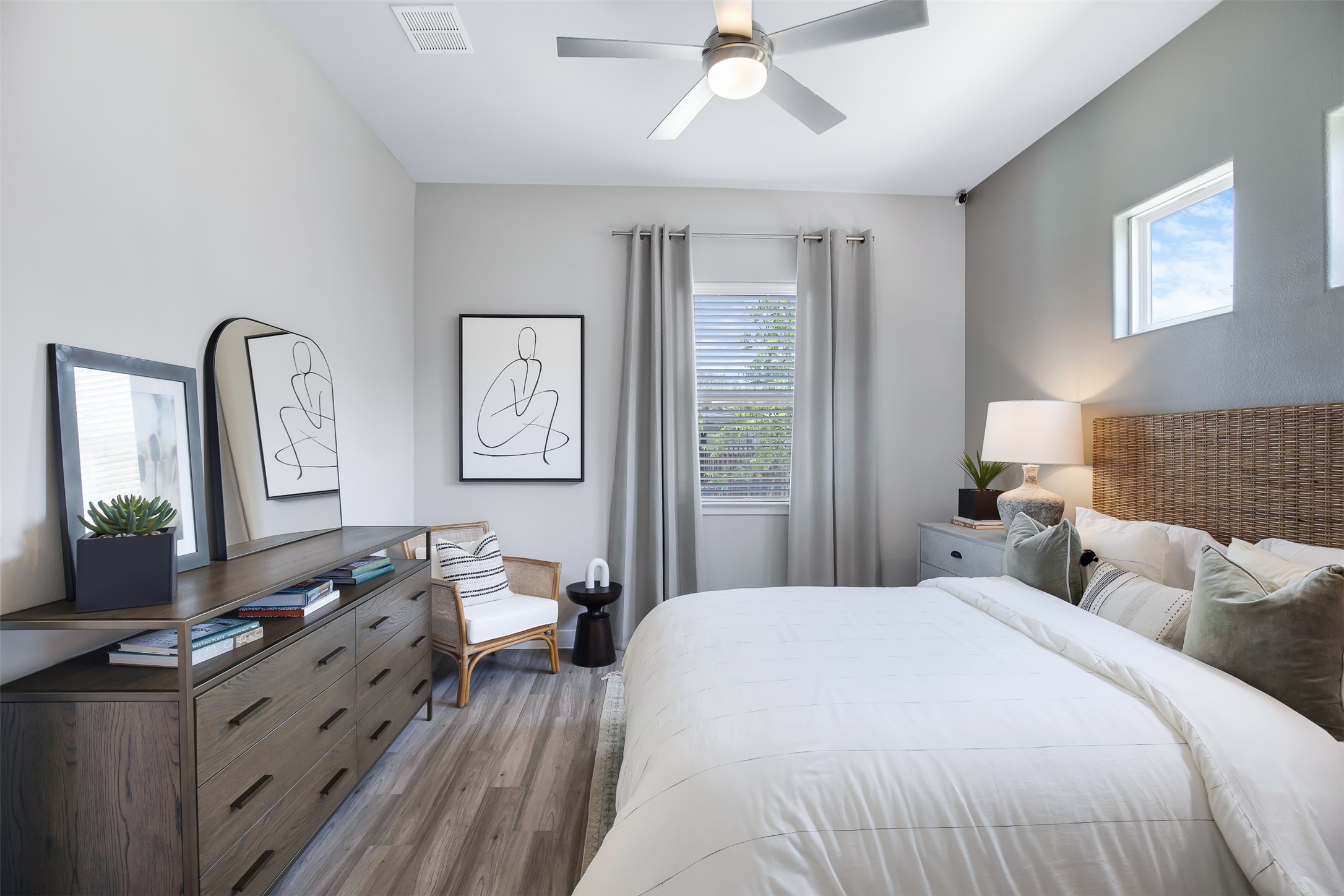 7225 Rustle Road Fort Worth, TX 76123 - Photo 19 of 38 a bedroom with a large bed and wooden floor