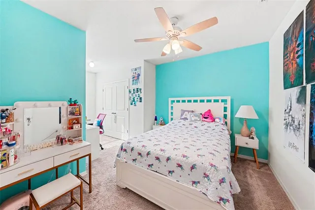 a bedroom with a bed and a table in it