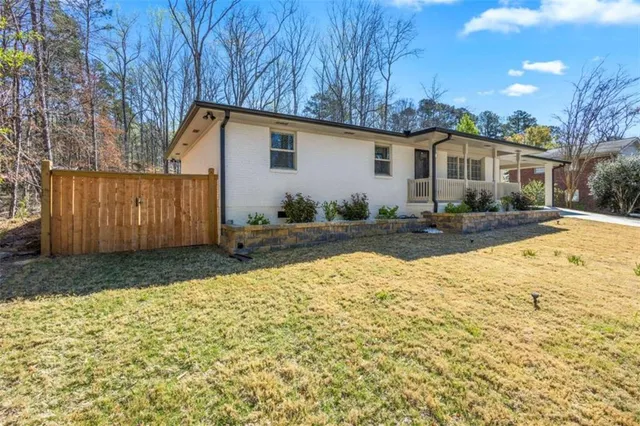 a view of a backyard with a tree