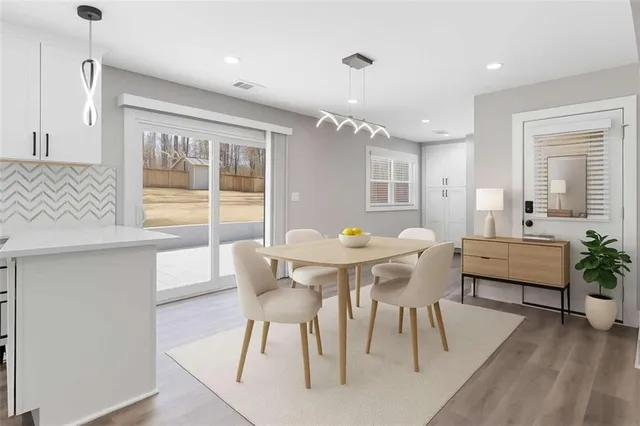a living room with stainless steel appliances kitchen island granite countertop furniture and a kitchen view