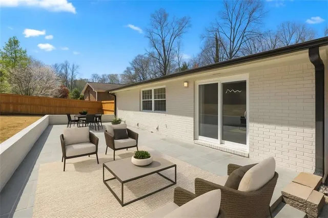 a spacious bedroom with a bed and a couch