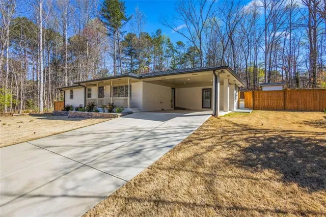 a view of the house with a yard