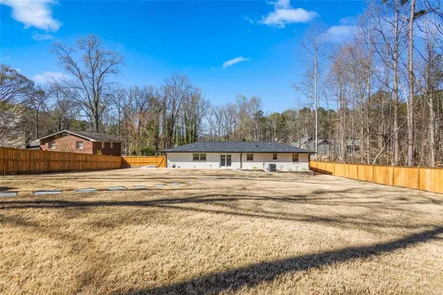 a view of a swimming pool with a house