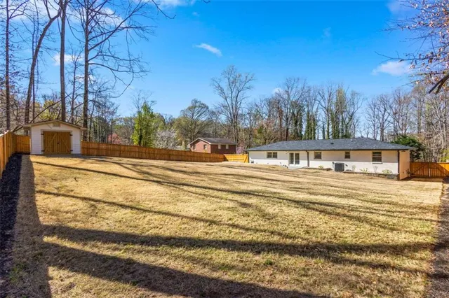 a view of a house with snow on the road