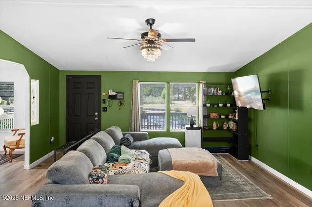 a living room with furniture and a window