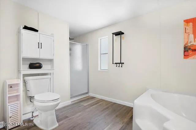 a bathroom with a toilet and a sink