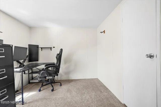 a view of a workspace with furniture