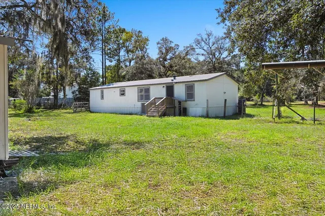 a view of front of house with a yard