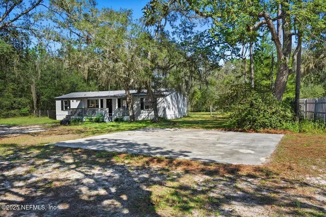 a view of house with yard